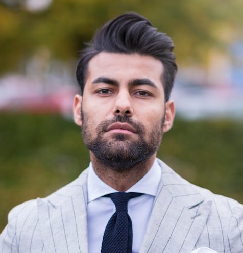 man in white and black pinstripe suit jacket
